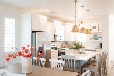 Modern kitchen with stainless appliances and spacious dining — perfect for family meals