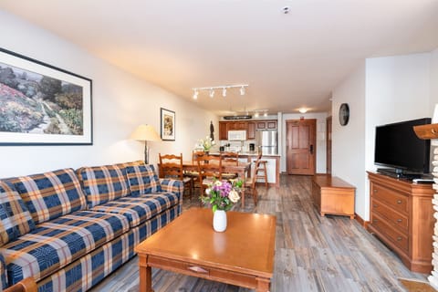 Living room w/ fireplace and smartTV