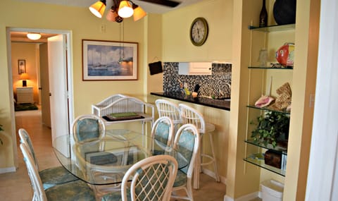 Dining room with seating for six plus two more at the high bar.