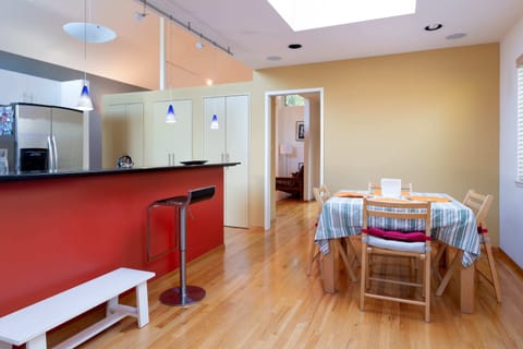 ... which adjoins one of the dining areas (in the back) and the kitchen (to the left)