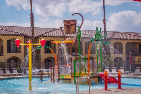 Dive into fun at the Splash Canyon water feature, where vibrant slides and playful splashes await.