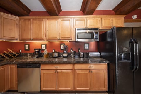 Full kitchen off of the living room.