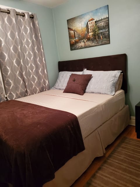 King Bedroom with smart TV on wall