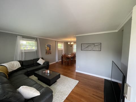 Spacious living room with leather sectional couch