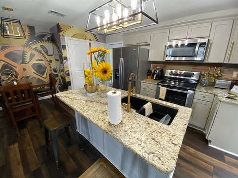 Beautiful kitchen with bar and eat in dining