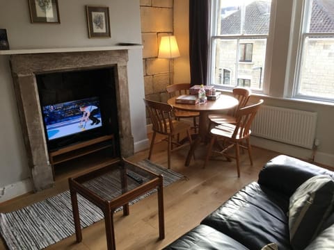 Living room with dining table and TV