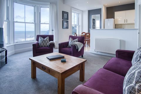 Open plan lounge, kitchen and dining room with stunning sea views