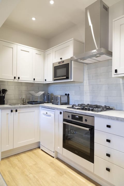 Newly refurbished kitchen with brand new appliances, including dishwasher