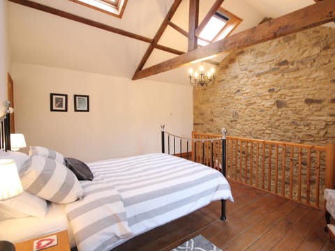 Bedroom, Wayside Cottage, with star-gazing velum windows above the bed.