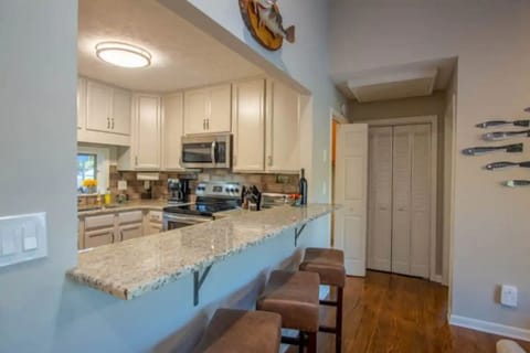 Open kitchen so the cook won't get lonely (and can still see the lake). 