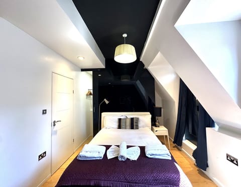 A spacious top-floor room featuring a large terrace, private bathroom, and kitchenette. Enjoy city views from the terrace. This cosy, comfortable space offers a perfect relaxing stay.
