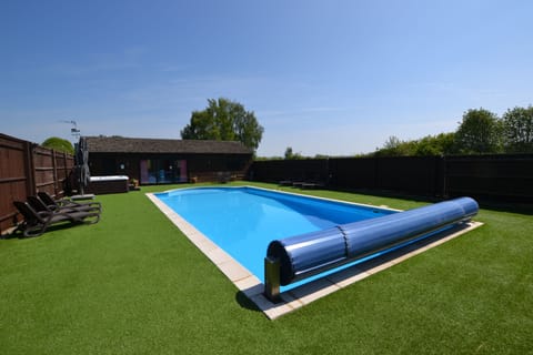 Fully enclosed and secluded garden with pool and hot tub (Exclusive to The Pool House)