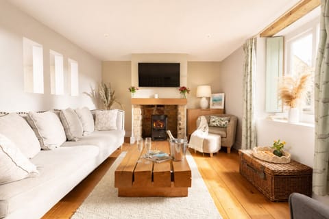 living room with fire on and champagne on arrival