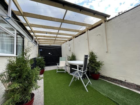 Outdoor space, partly covered, with direct access from apartment 1B bedroom