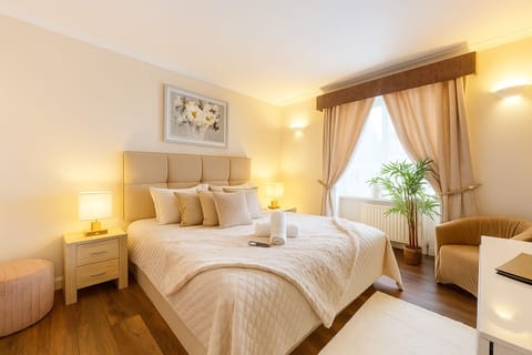 King-size bedroom in the One-Bedroom Apartment for a hotel-quality night’s sleep