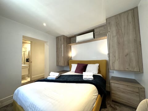 A standard studio featuring a fully equipped kitchen, private bathroom, clean and cosy double bed for a comfortable stay.