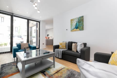 Living room with view of the front and kitchen area