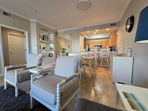 living area pov to Dining and Kitchen area