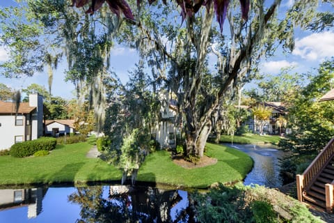 View from Balcony – Harbour Oaks 316, St. Simons Island - Gorgeous lagoon and oak canopy view from the private balcony at Harbour Oaks 316. A peaceful, scenic backdrop for your St. Simons Island vacation.