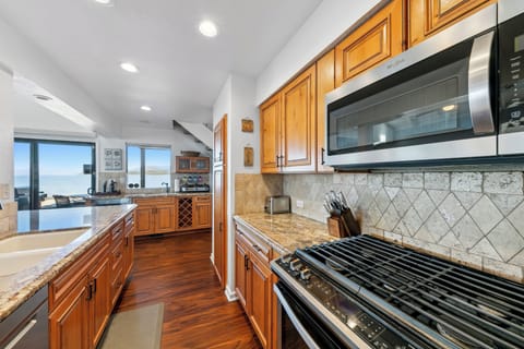 The kitchen is beautifully updated with stainless steel appliances.