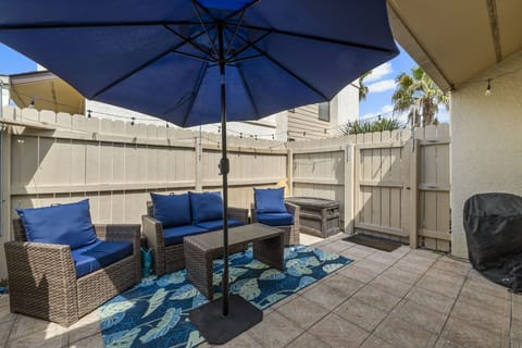 Cozy outdoor seating with large umbrella