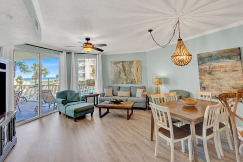 You'll love this bright, coastal living space where soft sea breezes flow through sliding doors to your private balcony.