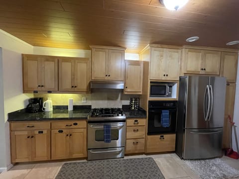 Coffee/ Tea Station, Kettle, Gas Range, Oven, Microwave, Refrigerator 