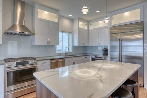 6-burner gas stove, oversized fridge, dishwasher, beverage fridge and microwave.