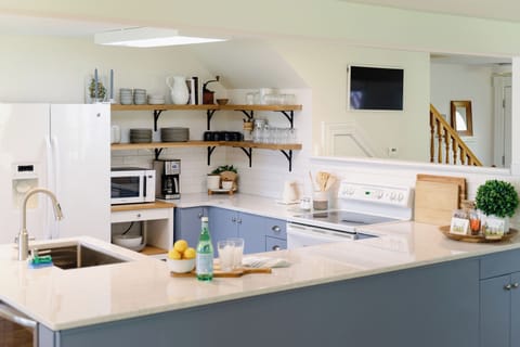 A large kitchen has everything a cook will need including a lobster pot