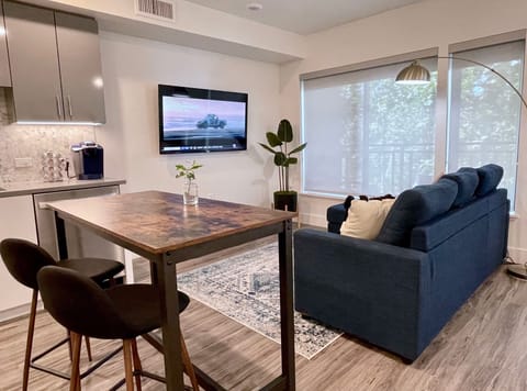 The living area with sofa sleeper and King Bed beyond.