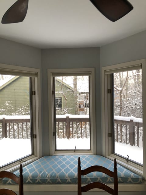 Bay Window w/ seating nook in dining room overlooking porch.
