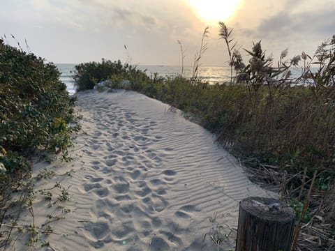 This path to the private beach is just a short walk from your beach house.