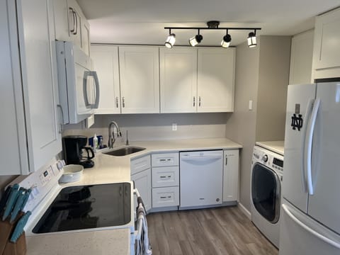 Well stocked kitchen. Tableware, cooking ware, blender, coffee pot, toaster