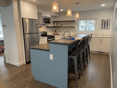 New kitchen with all new stainless steel appliances.