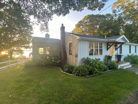 Front and Side of house with sunroom.