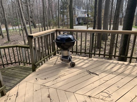 Charcoal grill on grilling deck. 