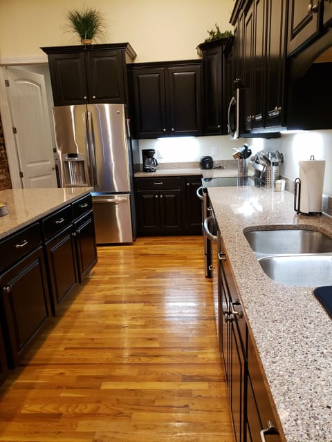 Spacious Kitchen with stainless steel appliances.