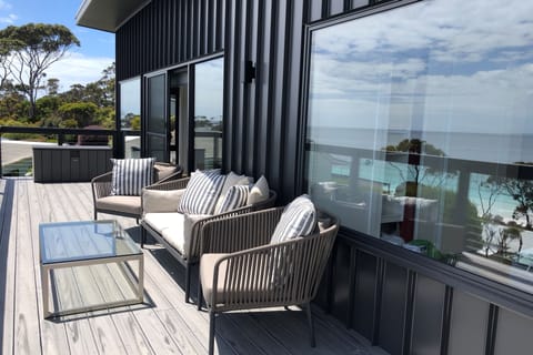 Deck has comfortable seating, and a WeberQ BBQ