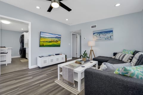 Living room with a smart TV that is enabled for streaming.