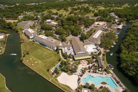 Escape to a sprawling waterfront resort with sparkling pool views.