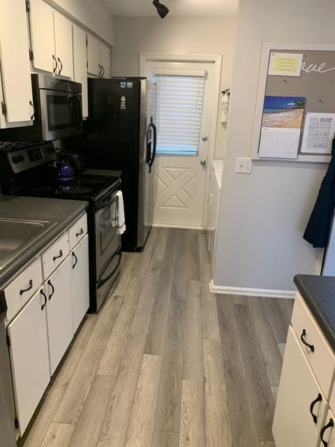 Fully stocked kitchen with full size washer and dryer.