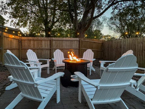 Propane fire pit with ample seating. Private and spacious fully fenced in yard at the Bank Haus