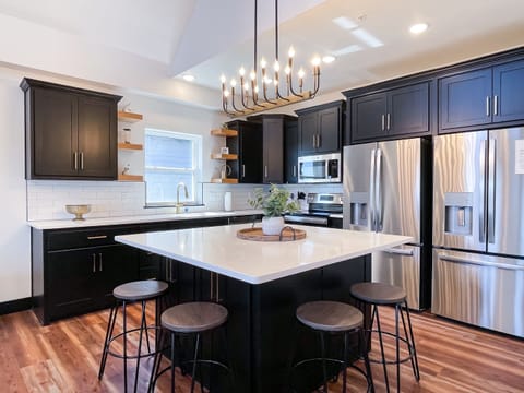 Main level kitchen with sufficient counter/prep space and double refrigerators
