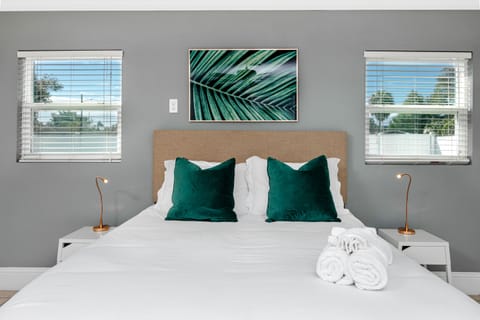 Bedroom: Stylish retreat with plush pillows and bright natural light streaming through!