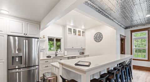 State of the art kitchen with stone counters and stainless appliances