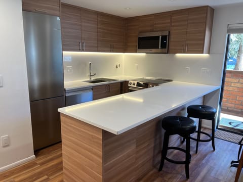 Brand new kitchen has Bosch Appliances, coffee, tea, and everything you need.