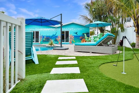 Check out the beautiful Mural poolside at Salty C Cottage!