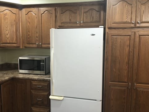 lots of kitchen cabinets for your storage. Fridge and microwave.