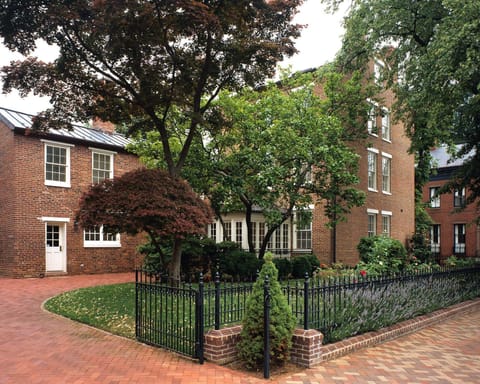View of side garden and driveway, with parking for up to 5 cars.