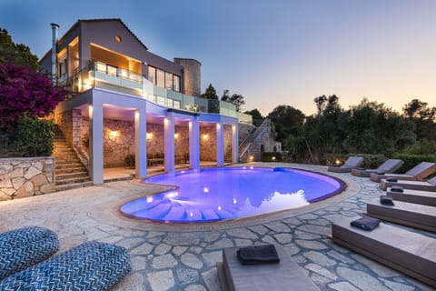 Outdoor pool with RGB light color program.